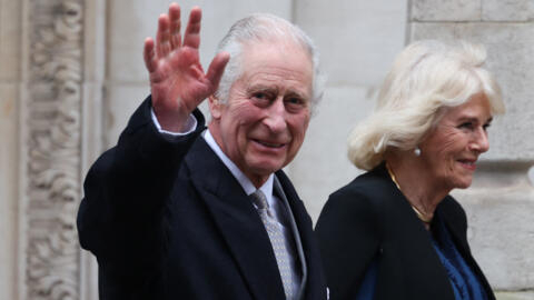 Britain's King Charles III waves as he leaves the London Clinic with Britain's Queen Camilla, in London, UK, January 29, 2024.