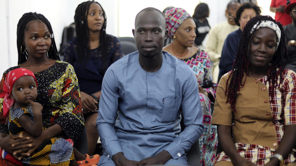 Jummai Mutah (left) and Amina Ali (right), two Chibok schoolgirls kidnapped in 2014 by Boko Haram, take part in an event marking the 10th anniversary of the abductions on April 4, 2024.