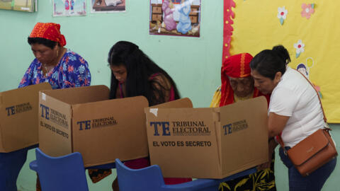 People vote at a polling station during the general election, in Panama City, Panama, May 5, 2024.