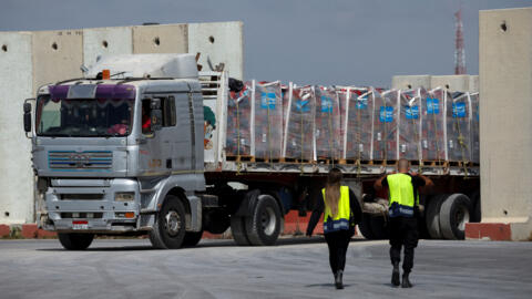A truck carrying humanitarian aid bound for the Gaza Strip drives at the inspection area at the Kerem Shalom crossing, amid the ongoing conflict between Israel and the Palestinian Islamist group Hamas