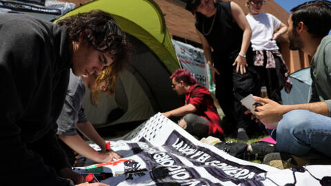 Students of the Complutense University of Madrid make banners after setting up a pro-Palestinian encampment in Madrid, Spain, May 7, 2024.
