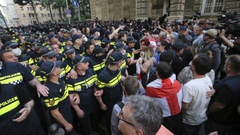 Police face demonstrators during an opposition protest against a "foreign influence" bill near the Parliament building in Tbilisi, Georgia, on Wednesday, May 1, 2024.
