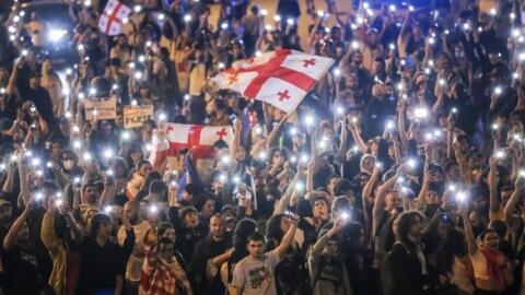 Demonstrators wave Georgian national flags during an opposition protest against "the Russian law" in the center of Tbilisi, Georgia, on Thursday, May 2, 2024.