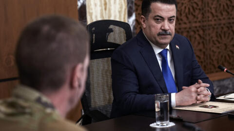 Iraqi Prime Minister Mohamed Shia al-Sudani chairs a meeting with top-ranking officials of the US-led coalition on January 27, 2024.