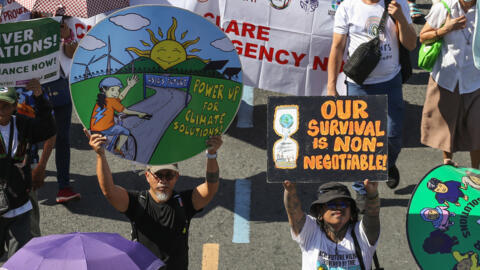 Des manifestants participant à la Journée mondiale d'action pour la justice climatique, le 9 décembre 2023, à Quezon City aux Philippines.