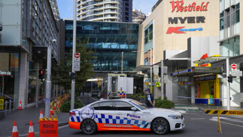 A police officer stands at police cordon near the knife attack scene at Bondi Junction in Sydney, April 15, 2024.