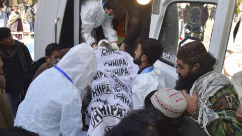 Emergency workers transport a victim of a bomb blast at a hospital in Quetta, Pakistan, February 7, 2024.