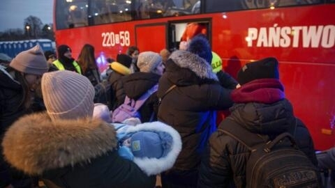 File photo of Ukrainian refugees, mostly women with children, wait to board a bus at the border crossing in Medyka, Poland on March 6, 2022.