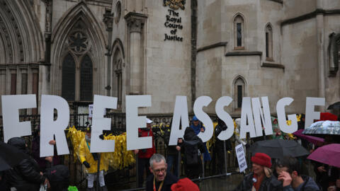 Supporters of Assange and Wikileaks demonstrate outside a  London court on February 21, 2024.