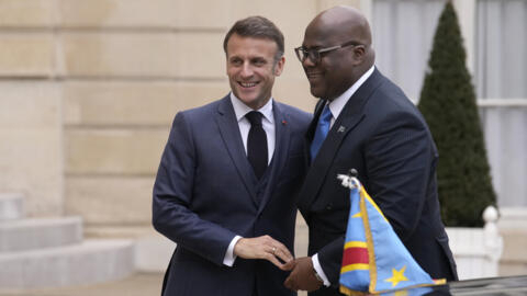 Congo's President Felix Tshisekedi, right, is greeted by French President Emmanuel Macron before a meeting at the Élysée Palace in Paris, April 30, 2024. 