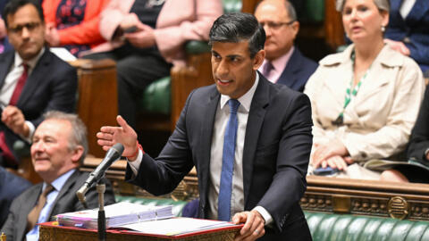 A handout photograph released by the UK Parliament shows Britain's Prime Minister Rishi Sunak speaking during Prime Minister's Questions on May 1, 2024.
