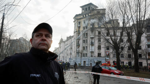 Rescuers work at a site of a building, damaged in a Russian missile strike on Kyiv, Ukraine, on March 21, 2024.