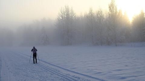 A cross-country skier is seen on the skiing trail in Vantaa, Finland, on December 9, 2022. 