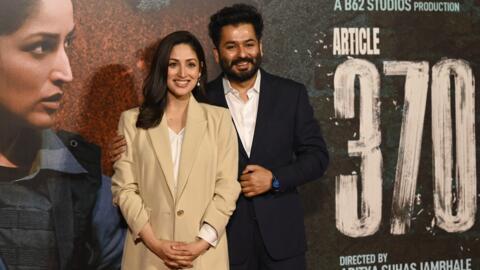 Bollywood actress Yami Gautam Dhar with her husband and producer-screenwriter Aditya Dhar at the trailer launch of their film "Article 370" in Mumbai on February 8, 2024.