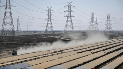 Workers installing solar panels at the Khavda Renewable Energy Park in Khavda, India, on 12 January, 2024.