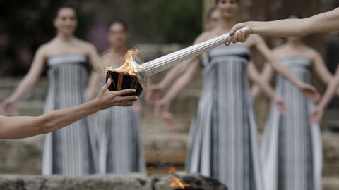 Greek actress Mary Mina, playing the role of High Priestess, lights the flame during the Olympic Flame lighting ceremony for the Paris 2024 Olympics.