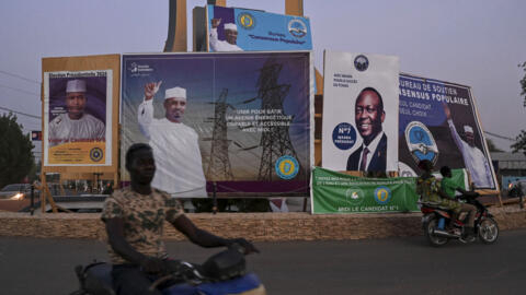 Campaign posters for Chad's presidential candidates in N'Djamena on 2 May 2024. 