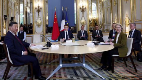 French President Emmanuel Macron, center, China's President Xi Jinping and European Commission President Ursula von der Leyen attend a trilateral meeting at the Elysee Palace as part of the Chinese president's two-day state visit in France, Monday, May 6, 2024 in Paris. 