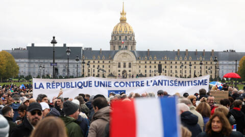 People attend a demonstration against anti-Semitism amid the ongoing conflict between Israel and the Palestinian Islamist group Hamas, in Paris on 12 November, 2023.