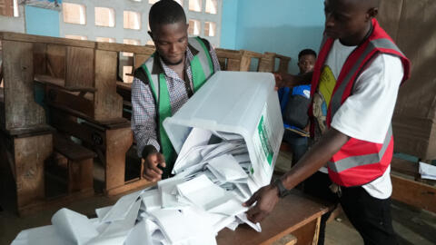 Electoral officials prepare the counting of votes at a polling station in Lome on 29 April, 2024, during Togo's legislative elections. 