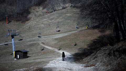 A closed chair-lift at a ski slope without snow on Mount Terminillo in Italy, where unseasonably high temperatures has melted snow, creating a challenging ski season, 1 February, 2024. 