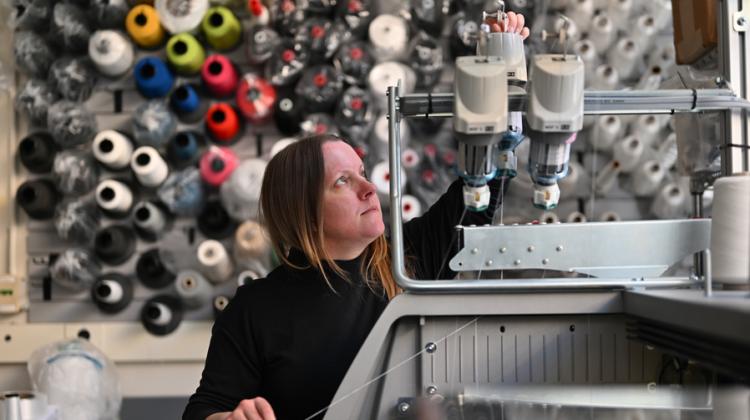 woman with spools of thread