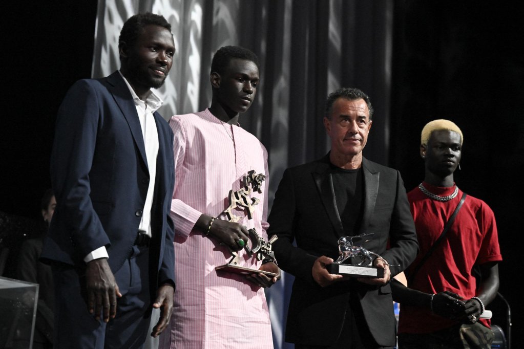 Mamadou Kouassi (on the far left, wearing a suit) with Moustapha Fall, Matteo Garrone and Paul Sarr at the 2023 Mostra Film Festival in Venice. | Photo: Societa Veneziana per il Cinema