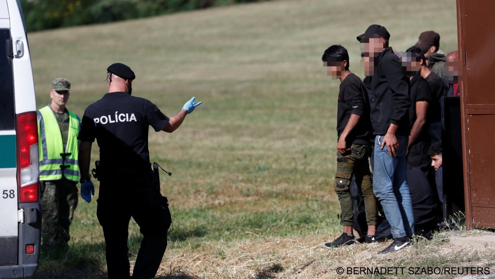 From file: Migrants board a van after being detained by Slovakian police close to the Slovakia-Hungary border | Photo: Bernadett Szabo/Reuters