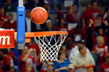 An image featuring a basketball going inside of a hoop