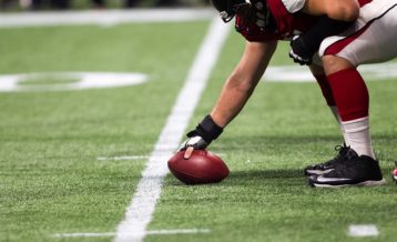 an image of a football player preparing to hit the ball