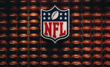 an image of the nfl logo with footballs in the background