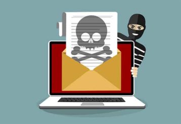 An image featuring a pirate hiding behind a laptop with a message that is printing and that has a pirate sign representing internet piracy