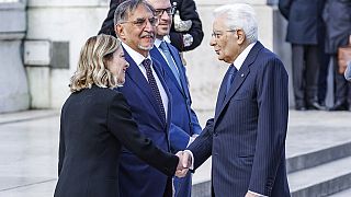 Italy's Prime Minister Giorgia Meloni shakes hands with President Sergio Mattarella at 79th anniversary of Liberation Day (Roberto Monaldo/LaPresse via AP)