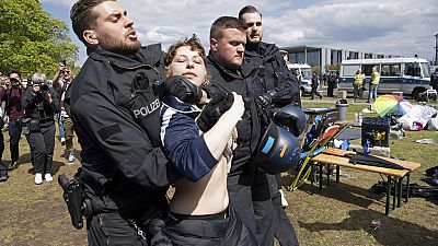 Protesters being escorted out of pro-Palestinian camp in Berlin