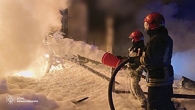 Emergency services personnel work to extinguish a fire in Ivano-Frankivsk region