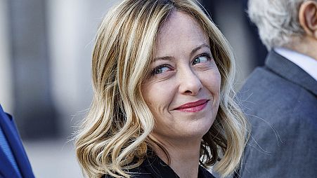 Italian Premier Giorgia Meloni arrives at the tomb of the unknown soldier for the solemn Liberation Day commemoration, in Rome