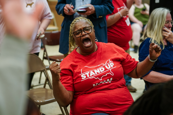 A Volkswagen employee celebrates as results of a unionization vote trickle in at a United Auto Workers vote watch party on April 19, 2024, in Chattanooga, Tennessee.