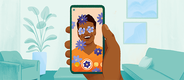 A mobile phone screen of a man taking a selfie with a flower filter applied to the face.
