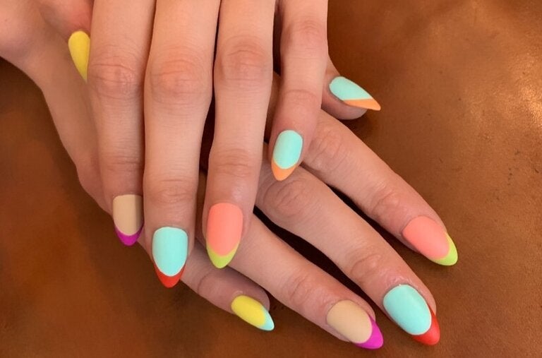A French mani multicolor design by the nail artist Mei Kawajiri.