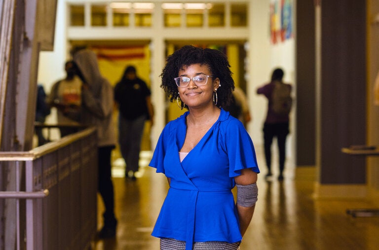 Joi Mitchell didn’t want to follow family members into classroom teaching but found a way to work with students by serving as a tutor, including on the Cardozo campus.