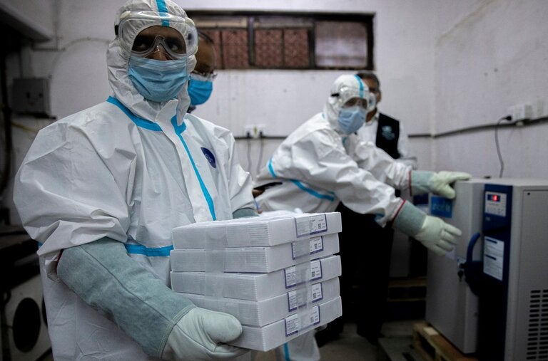 Nepalese health workers prepared Covid vaccines, obtained through the Covax program, for storage in Kathmandu, Nepal, in 2021.