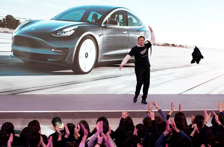 Elon Musk dancing in 2020 as his company, Tesla, unveiled the first cars made at its factory in Shanghai.