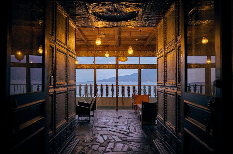 A lounge at GuestHouse Carapan in Kagoshima City, Japan, looks across to the Sakurajima volcano in Kagoshima Bay.