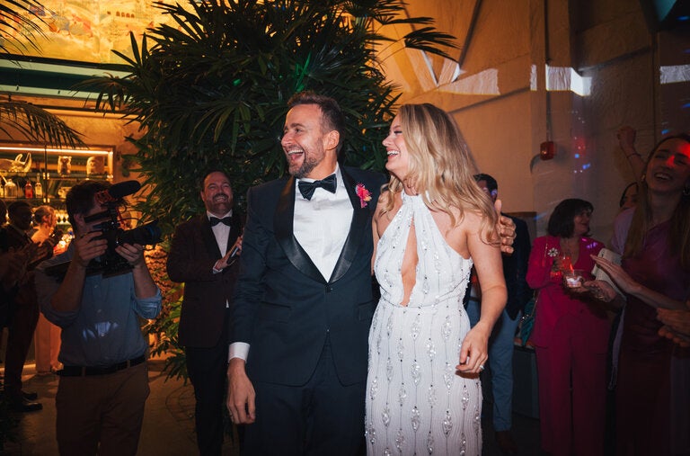 Eli Newell and Dr. Erika Amundson, who were legally married last May before Mr. Newell was rushed to the hospital, held a wedding celebration Feb. 23 at the Grass Room in Los Angeles.