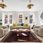 The upstairs living room at 259 West Fourth Street features an assortment of contemporary art and furnishings.