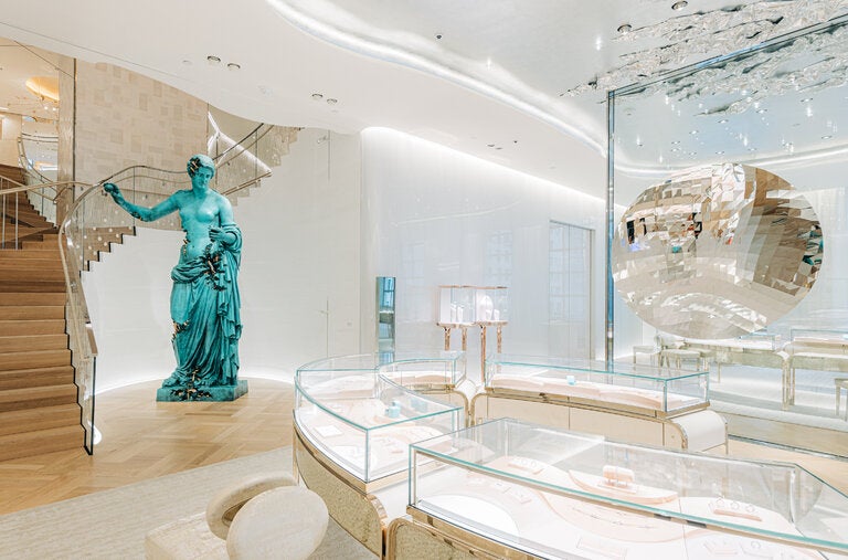 Looming next to vitrines filled with engagement rings are Daniel Arsham’s “Bronze Eroded Venus of Arles” (2022), at left, and Anish Kapoor’s “Random Triangle Mirror” (2016) at right, on the third floor of the Tiffany flagship store on Fifth Avenue.