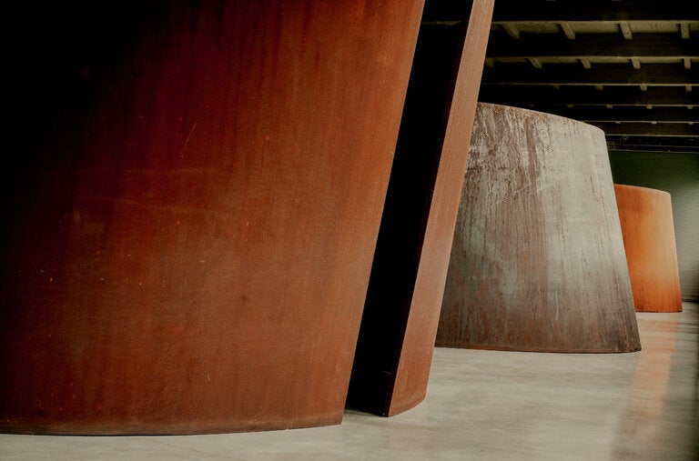 Three of Richard Serra’s “Torqued Ellipses,” from 1996-97, now on permanent view at the Dia Art Foundation in Beacon, N.Y. The curving steel plates have oxidized since their debut from vermilion to dark brown.