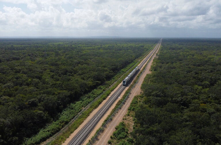 Designed to travel in a 965-mile loop when completed, the Maya Train will whisk passengers to the Yucatán Peninsula’s colonial cities, archaeological sites, splashy resorts and tropical forests.