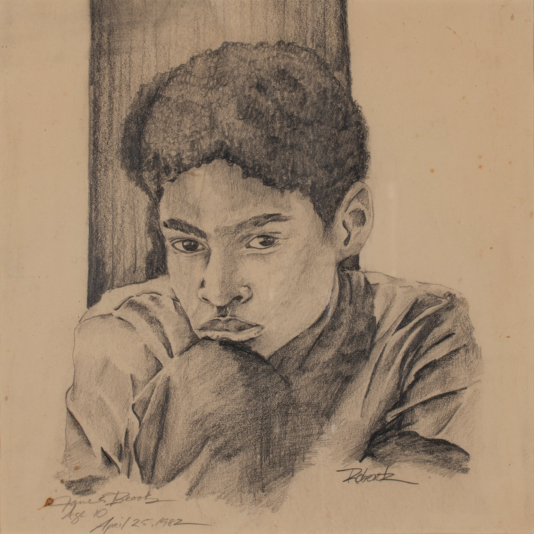 A drawing of a boy resting his chin on his knee.