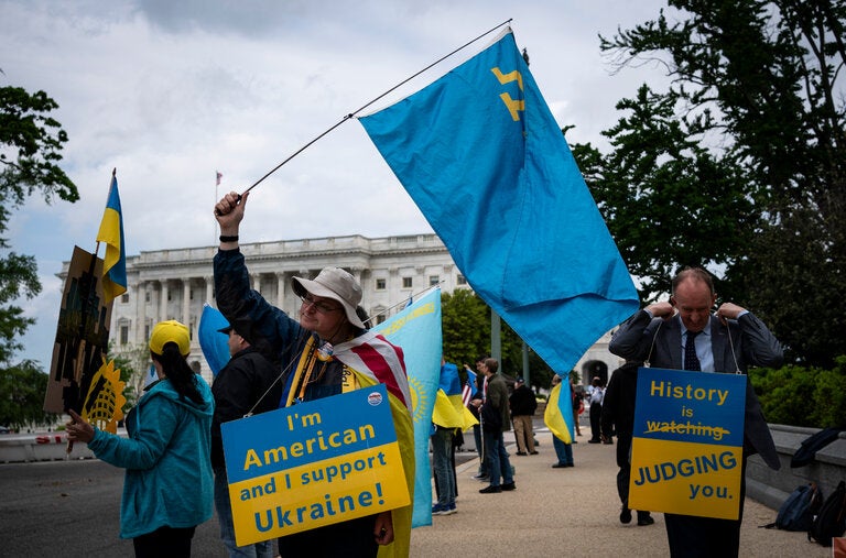 Demonstrators gathered outside the Capitol Saturday as the House voted overwhelmingly to approve an aid package for Ukraine.